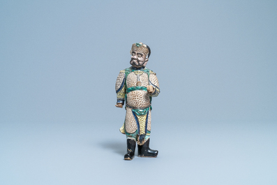 A Chinese verte biscuit figure of a Guandi, Kangxi