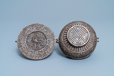 A reticulated polished steel bowl and cover with dragons, Tibet, 16/17th C.