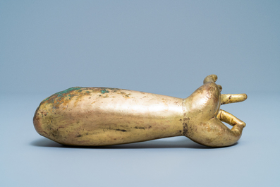 A Tibetan gilt bronze and copper alloy arm of Buddha, Ming