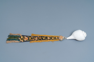 A TIbetan conch shell with embroidered silk ribbon, 19th C.