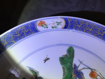 A pair of Chinese famille verte 'ducks in a lotus pond' plates, Kangxi