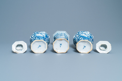 A Dutch Delft blue and white three-piece vase garniture with a dog, 18th C.