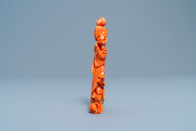 A Chinese carved red coral group of a lady, a squirrel and a rabbit, 19/20th C.
