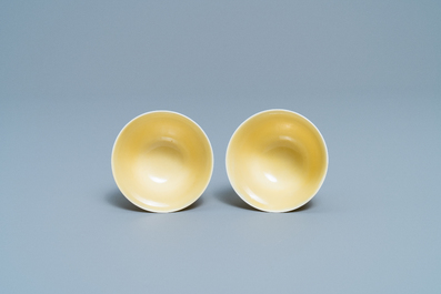 A pair of Chinese monochrome yellow wine cups, Kangxi mark and of the period