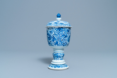 A Chinese blue and white beaker and cover with floral design, Kangxi