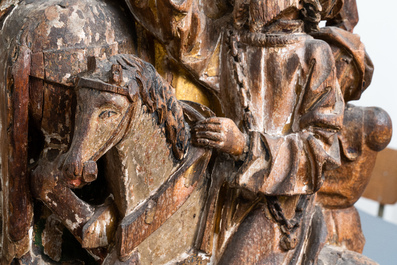 Two large polychromed wood 'Crucifixion' retable fragments, probably Brabant, 15/16th C.