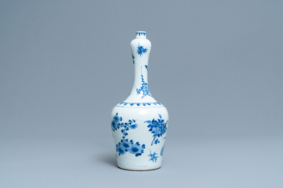 A Chinese blue and white bottle vase with floral design, Transitional period