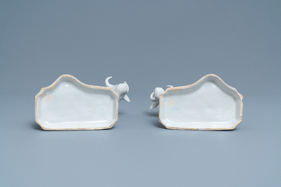 A pair of white Dutch Delftware groups of cows with milkers, 18th C.