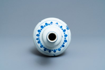 A Chinese blue and white bottle vase with floral design, Transitional period