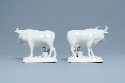 A pair of white Dutch Delftware groups of cows with milkers, 18th C.
