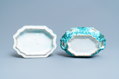 Une terrine couverte sur son support en fa&iuml;ence de Bruxelles &agrave; d&eacute;cor de papillons et chenilles, 18&egrave;me