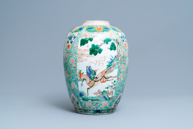 A large Chinese famille verte 'mythical beasts' jar with wooden cover, Kangxi