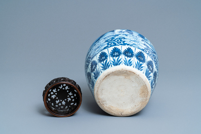 A large Chinese blue and white jar with wooden cover, Kangxi