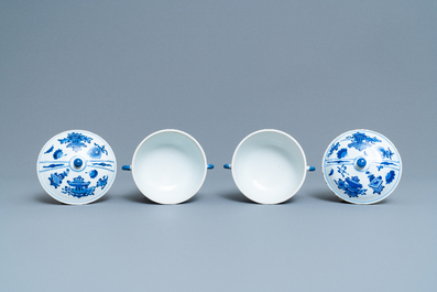 A pair of Chinese blue and white 'antiquities' bowls and covers, Kangxi