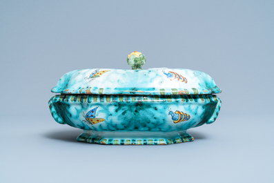Une terrine couverte sur son support en fa&iuml;ence de Bruxelles &agrave; d&eacute;cor de papillons et chenilles, 18&egrave;me