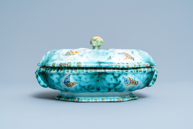 Une terrine couverte sur son support en fa&iuml;ence de Bruxelles &agrave; d&eacute;cor de papillons et chenilles, 18&egrave;me