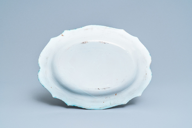 Une terrine couverte sur son support en fa&iuml;ence de Bruxelles &agrave; d&eacute;cor de papillons et chenilles, 18&egrave;me