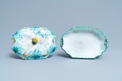 Une terrine couverte sur son support en fa&iuml;ence de Bruxelles &agrave; d&eacute;cor de papillons et chenilles, 18&egrave;me