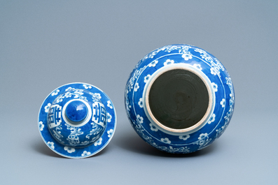 A Chinese blue and white 'butterfly' vase and cover, 19th C.