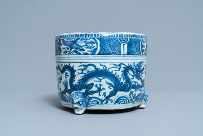 A Chinese blue and white 'dragon' tripod censer, Ming
