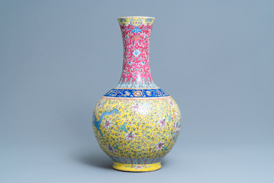 A large Chinese yellow-ground famille rose 'dragon and phoenix' bottle vase, 19th C.