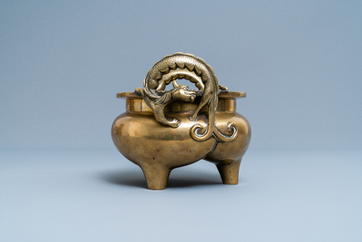 A Chinese bronze chilong-handled tripod censer, seal mark, 17/18th C.