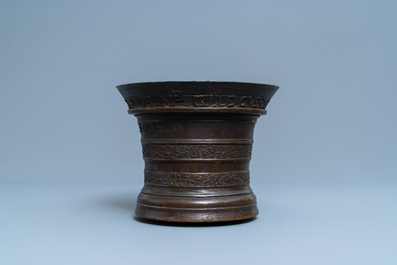 A large Flemish bronze mortar dated 1604 and inscribed Lille