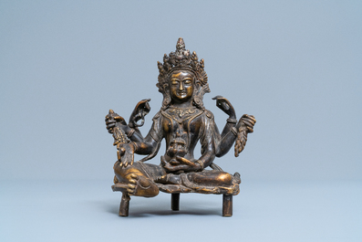 A Nepalese solid bronze figure of Vasudhara, 19th C.