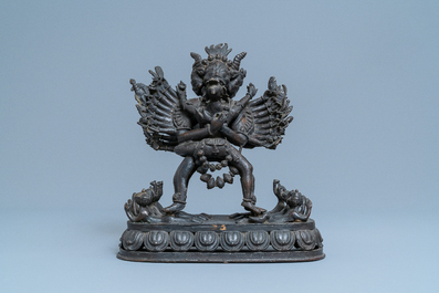 A Tibetan bronze group of Mahakala and his consort Yab-Yum, 19th C.