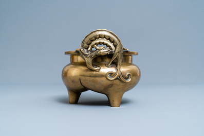 A Chinese bronze chilong-handled tripod censer, seal mark, 17/18th C.