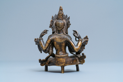 A Nepalese solid bronze figure of Vasudhara, 19th C.