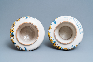 An important pair of large inscribed Italian maiolica drug jars and covers, Naples, dated 1724