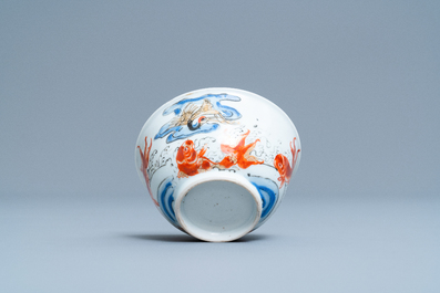 A Chinese 'crane and carps' cup and saucer, Yongzheng