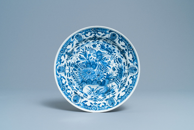 A Chinese blue and white dish and two plates after Dutch Delft examples, Kangxi/Qianlong