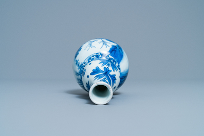 A Chinese blue and white double gourd vase with figures in a landscape, Transitional period