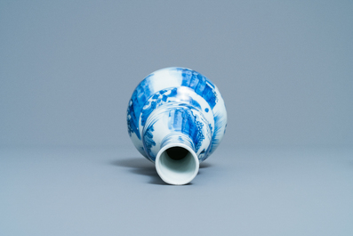 A Chinese blue and white double gourd vase with figures in a landscape, Transitional period