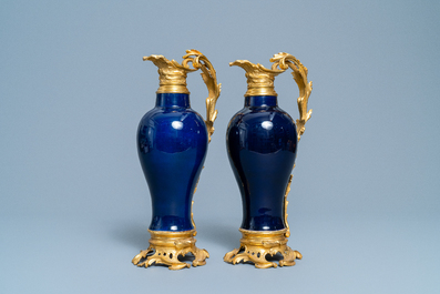 A pair of Chinese gilt bronze ewer-mounted monochrome blue vases, 18/19th C.