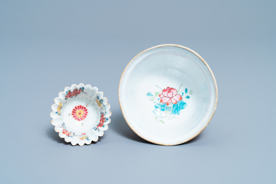 A Chinese famille rose cup and saucer and a 'magnolia' cup, Yongzheng
