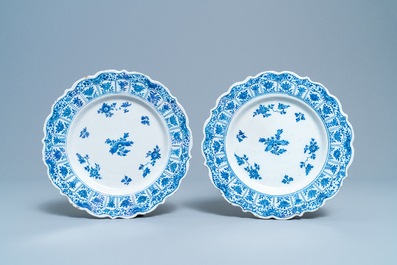 A pair of Dutch Delft blue and white strawberry strainers on stands, 18th C.