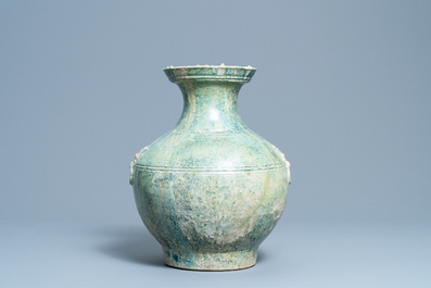 A Chinese monochrome green-glazed jug, Han