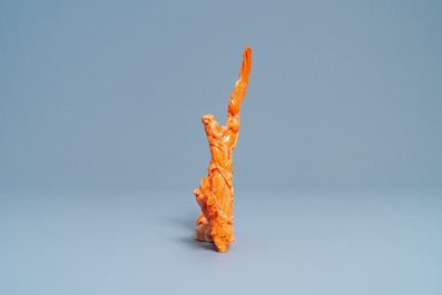 A Chinese carved red coral group of a lady with a bird, 19/20th C.