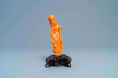 A Chinese carved red coral figure of Shou Lao, 19/20th C.