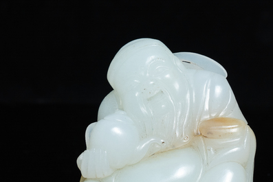 A Chinese white jade figure of Li Taipo, Kangxi/Yongzheng