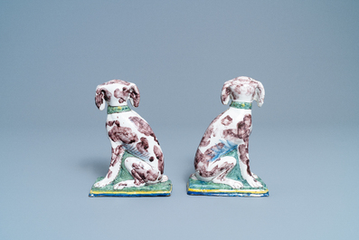 A pair of polychrome Dutch Delft money banks modelled as dogs, 18th C.