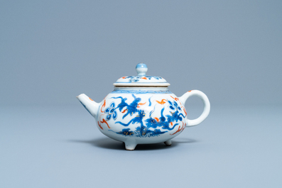 A rare Chinese blue, white, iron red and gilt tripod teapot and cover, Kangxi
