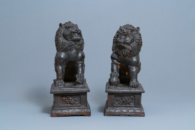 A pair of large Chinese cast iron models of lions, Ming mark and of the period