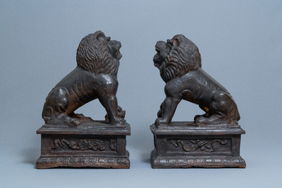 A pair of large Chinese cast iron models of lions, Ming mark and of the period