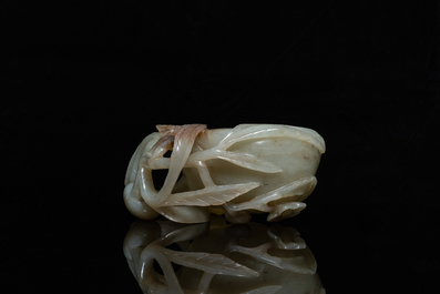 A Chinese mottled celadon and brown jade peach-form brush washer, Qing