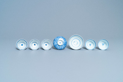 A varied collection of Chinese blue and white cups and saucers, Kangxi