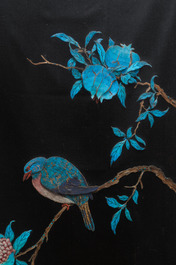 A Chinese black silk-ground panel with a kingfisher feather collage of a bird with pomegranates, 18/19th C.